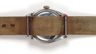 Steel wristwatch, worn canvas strap